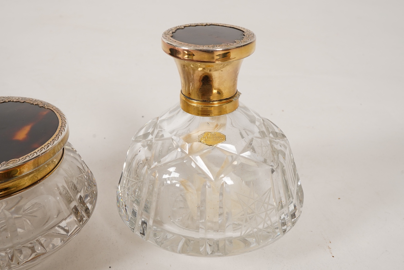 A mid 20th century continental eight piece gilt white metal and tortoiseshell mounted dressing table set